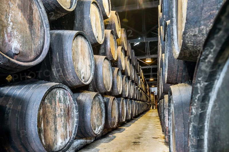 Plenty of port wine barrels in a wine cellar in Vila Nova de Gaia