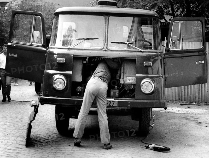 Man repairing trucks ca. 1970s