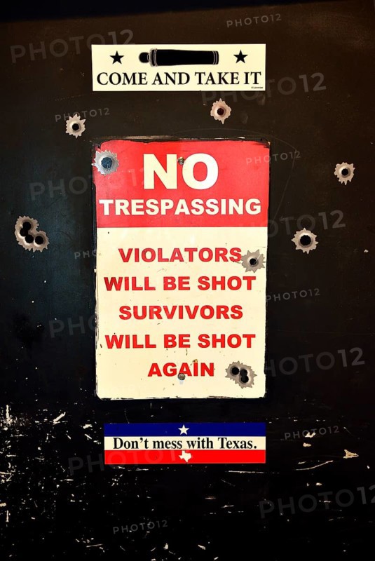 Toilet door with Texas slogans