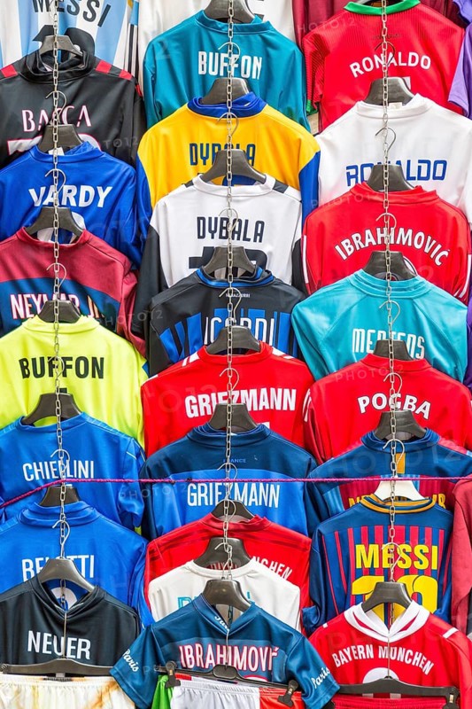 Football jerseys with names of football players for sale at sales stall