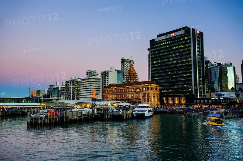 Illuminated waterfront with Ferry Building during dusk
