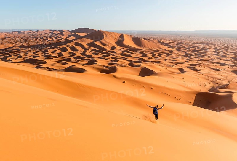 Woman running downhill