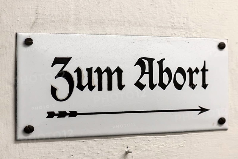Old enamel sign: Zum Abort