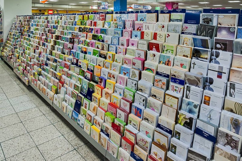 Shelf with postcards in a supermarket