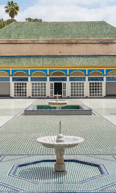 Ornate courtyard with columns and fountain
