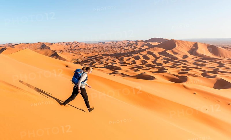 Woman running downhill
