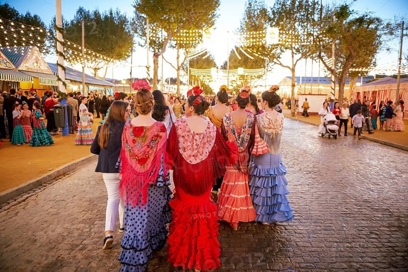 Spanish women with colorful flamenco dresses