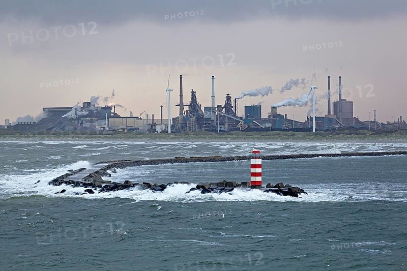 Industrial area and lighthouse in the harbour entrance