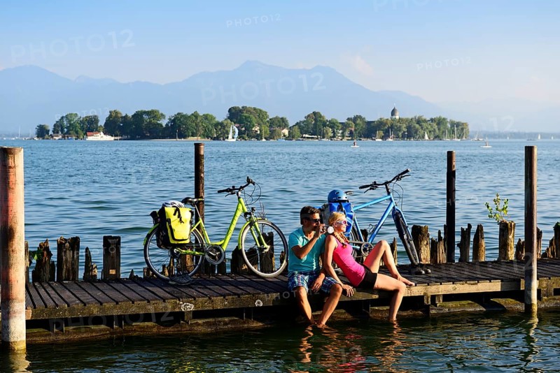 Cyclists resting on jetty