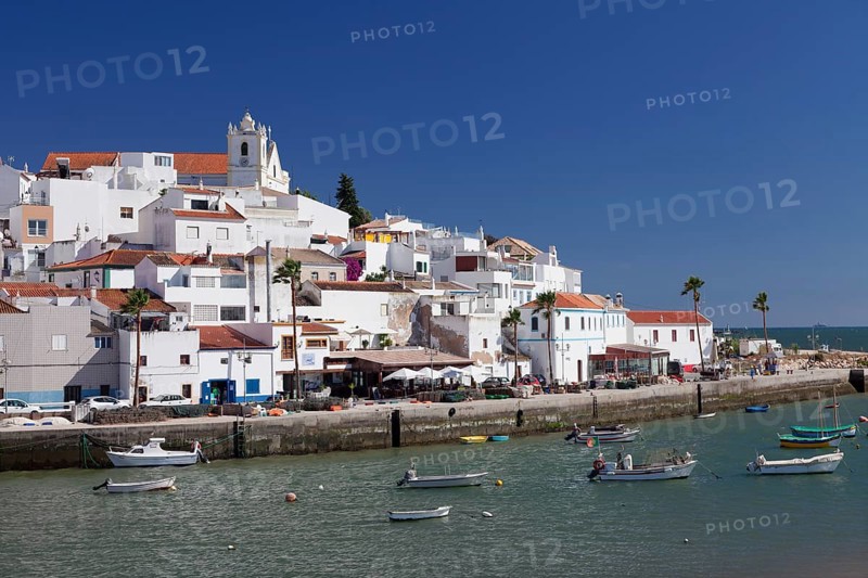 Boats in front of the fishing village of Ferragudo