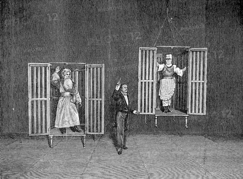 The illusionist Thorn demonstrates the appearance and disappearance of persons in cages