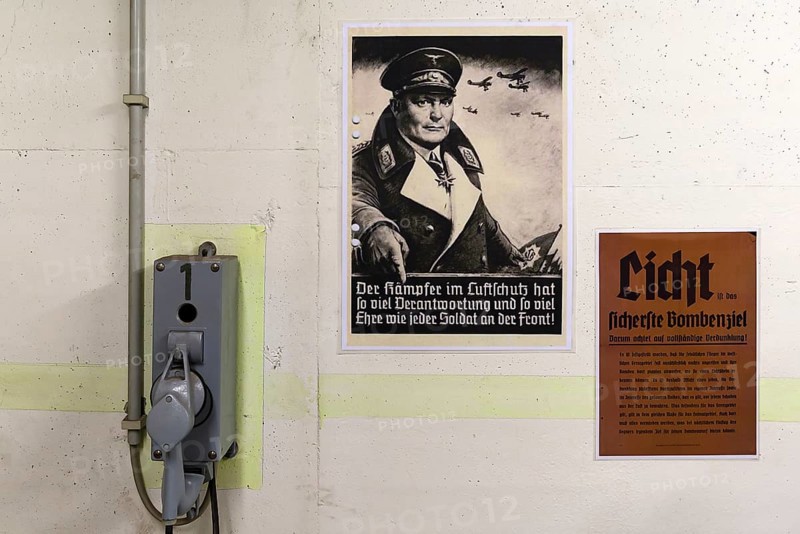 Bunker telephone and poster of Goring from a civil air-raid shelter in World War II