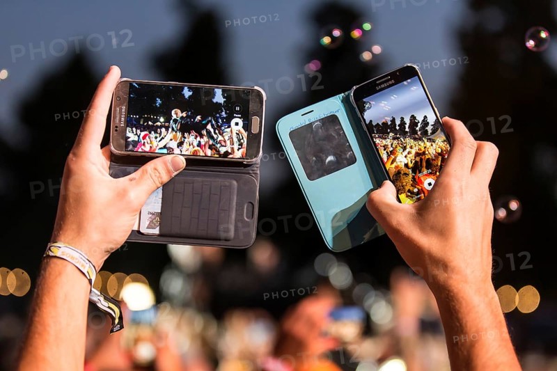 Festival visitor takes photos with Iphone from the British band Skunk Anansie and singer Deborah Anne Dyer alias Skin live at the 26th Heitere Open Air in Zofingen