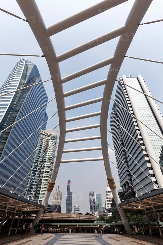 High-rise buildings in the business district Sathon and pedestrian bridge to BTS Skytrain station Chong Nonsi