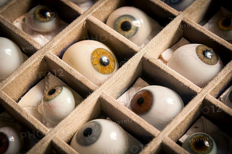 Artificial glass eyes in a box