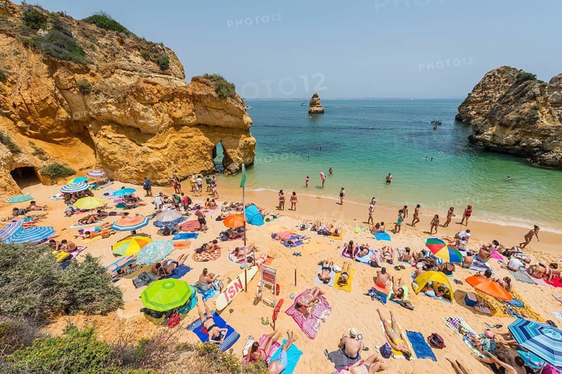 Tourists and bathers at the sandy beach