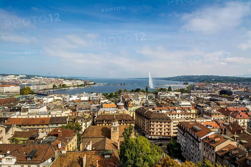 Cityscape with Lake Geneva Lake and the fountain Jet d'eau taken from a tower of the Cathedrale Saint Pierre