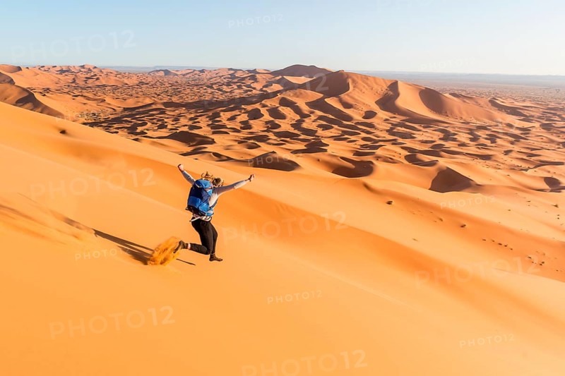 Woman running downhill
