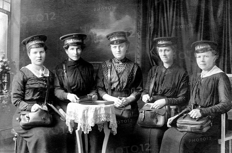 Women in uniform of an urban gasworks