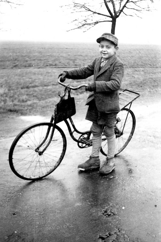Boy with bicycle