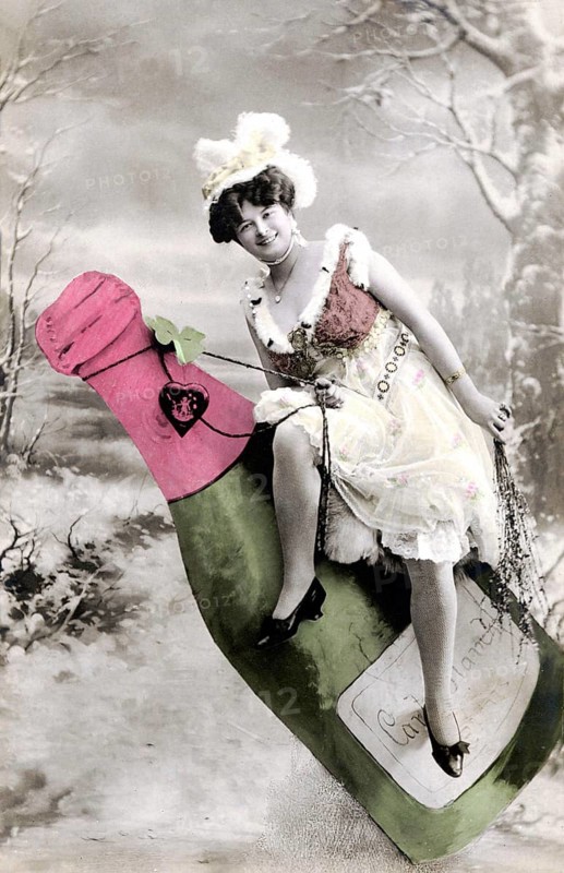 Woman sitting on champagne bottle