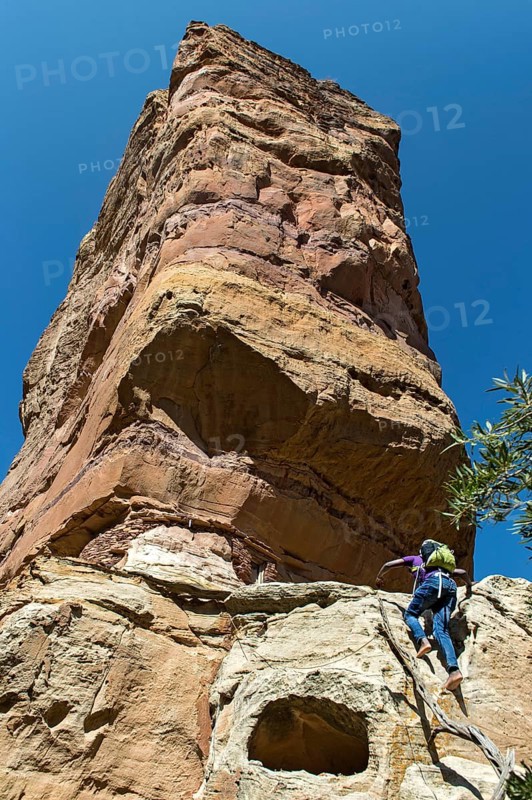 Local guide climbs to Abuna Yemata monolithic church in the Gheralta Mountains near Hawzen