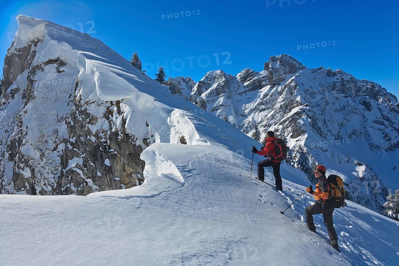 Two mountaineers on a ski tour in winter