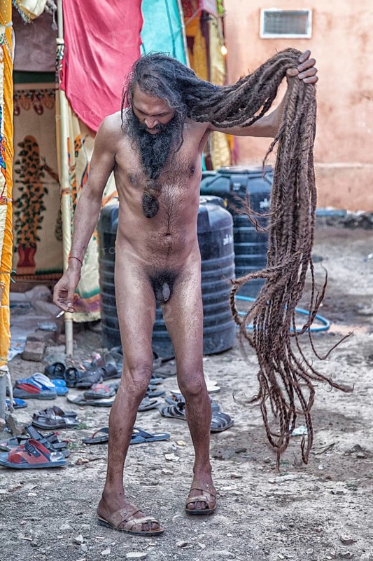 Naked Sadhu with long hair during Hindu festival Kumbh Mela