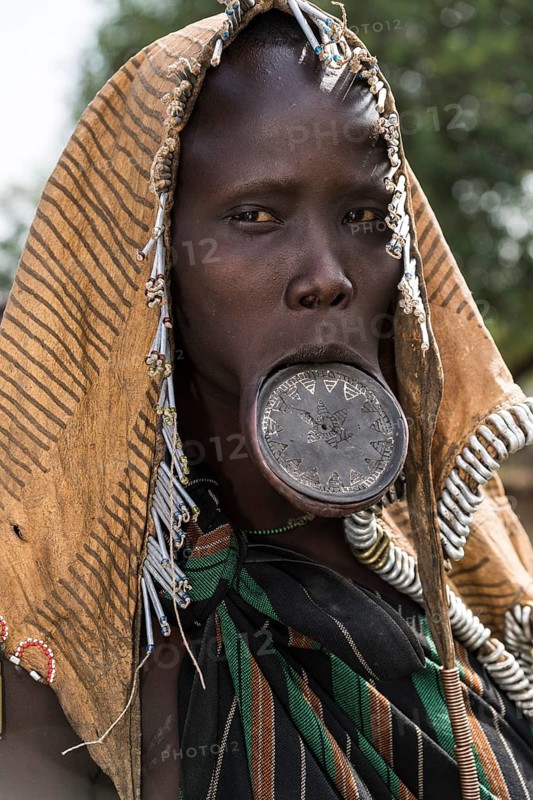 Woman with lip plates and headdress