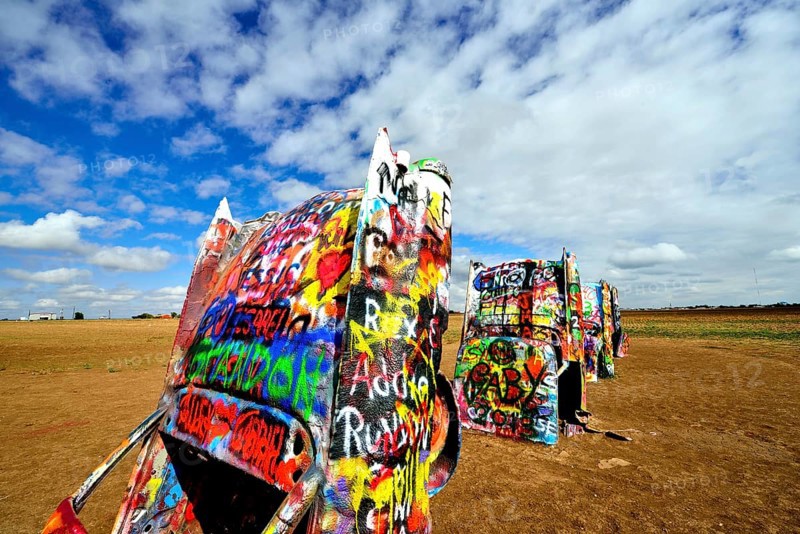 Painted Cadillacs rammed into the ground