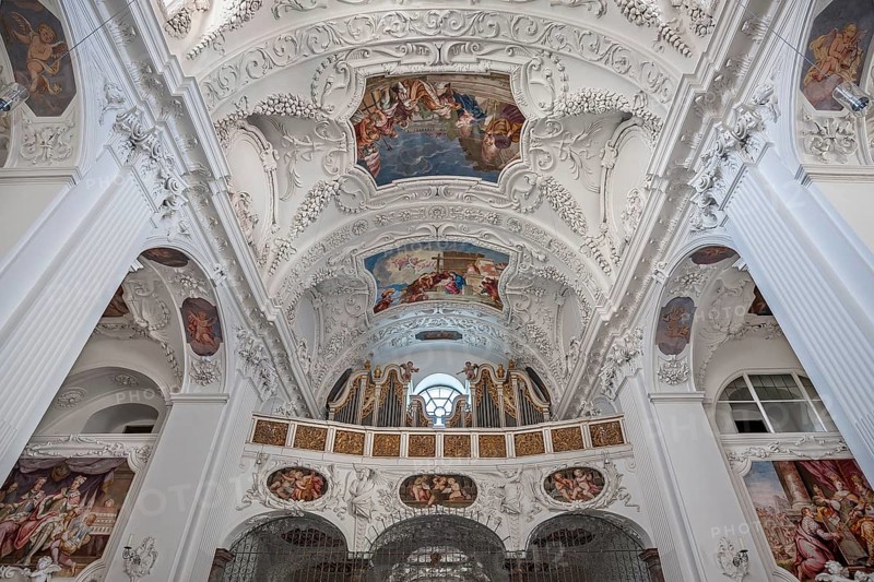 Interior view with organ gallery and ceiling frescoes and stucco