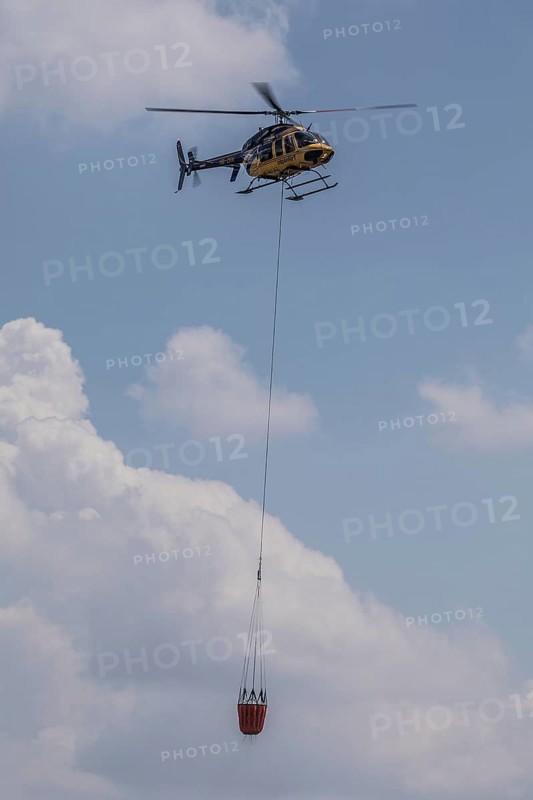 Helicopter with water tank for fire extinguishing