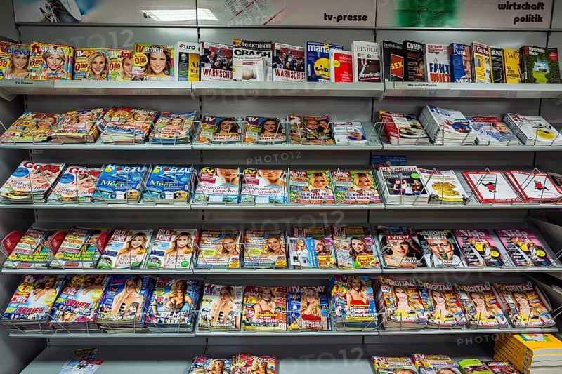 Shelf with magazines in a supermarket