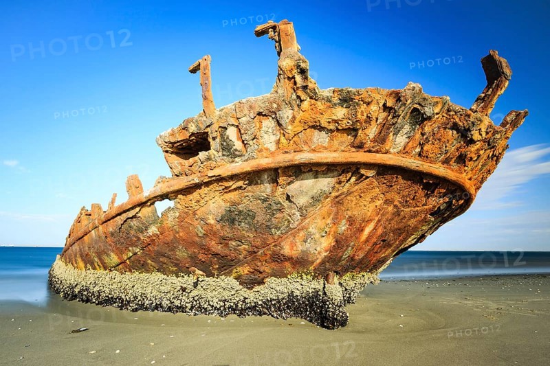 Rusty shipwreck on the beach