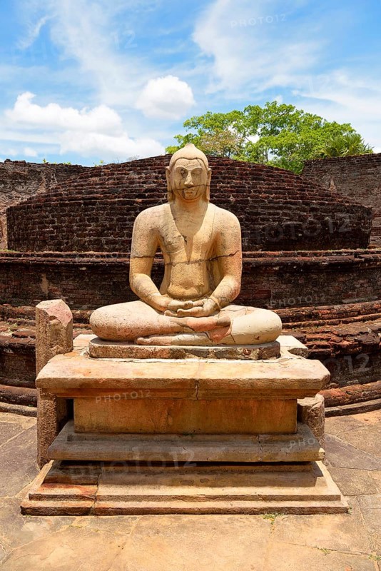 Ruin of a temple with moonstone and Buddha statue