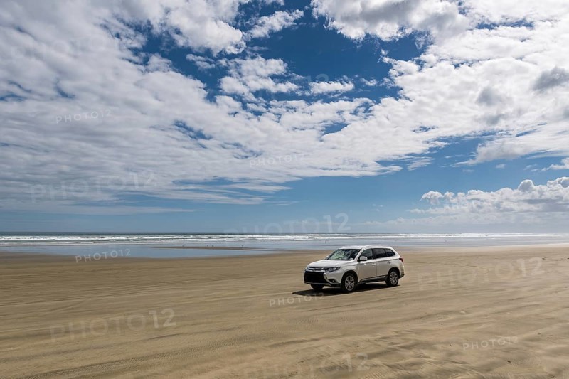 4x4 car at the wide sand beach