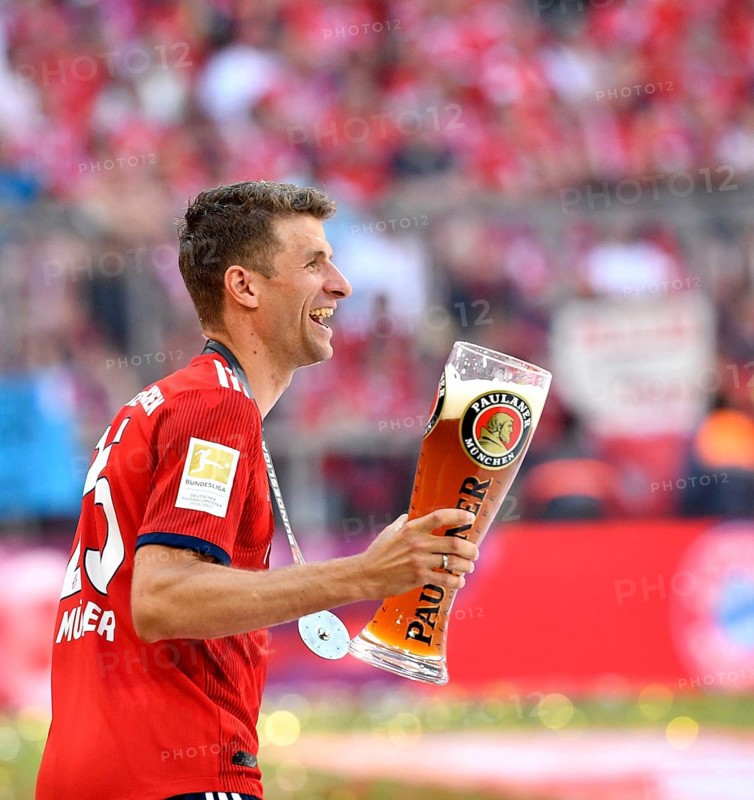 Thomas Muller FC Bayern Munich with Paulaner wheat beer for beer shower
