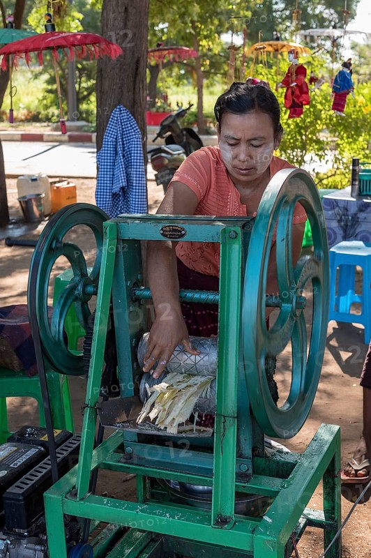 Street vendor of sugar cane juice with machine