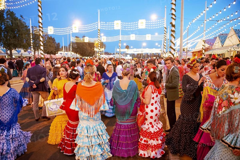 Spanish women with colorful flamenco dresses