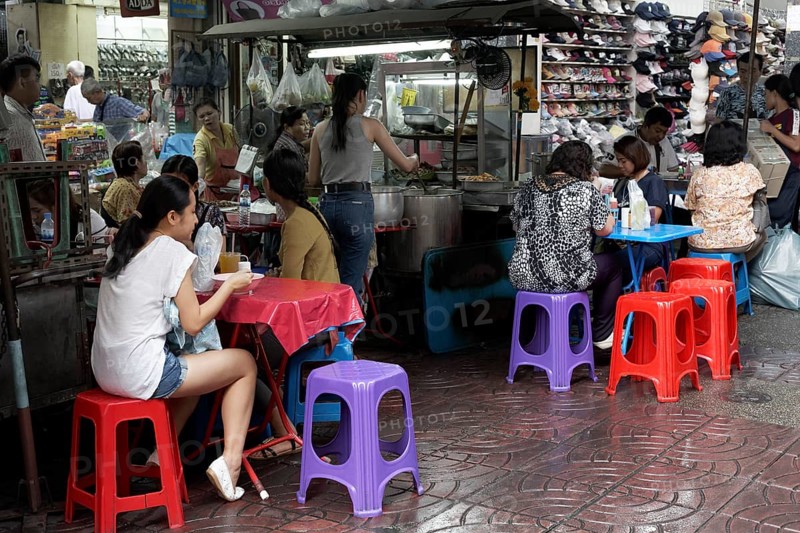 Streetfood stand with colourful tables and chairs