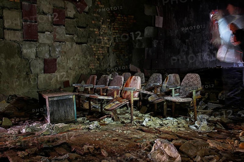 Cinema chairs in a destroyed building