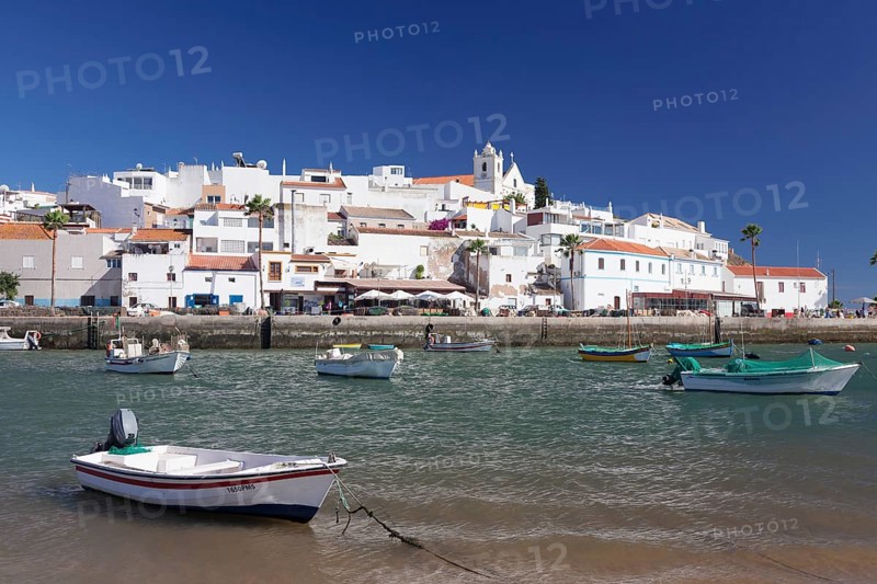 Boats in front of the fishing village of Ferragudo