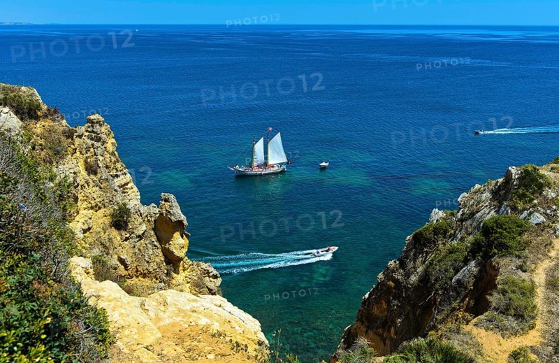 Sailboat and motorboats off Camilo Beach