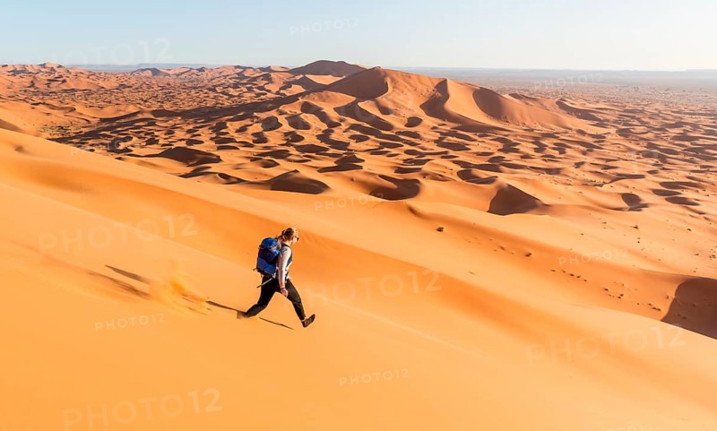 Woman running downhill