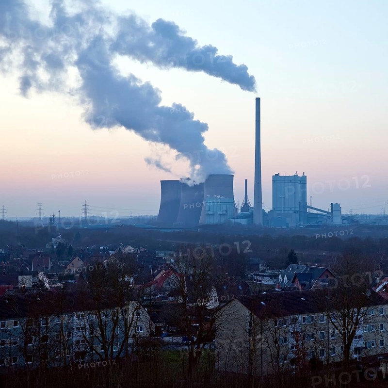 Housing estate with the Gersteinwerk power plant at sunset