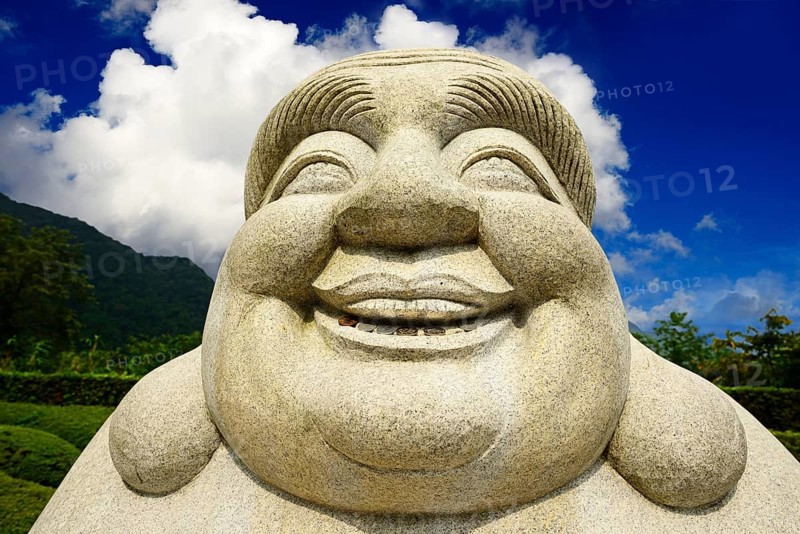 Ebisu Buddha with coins in his mouth