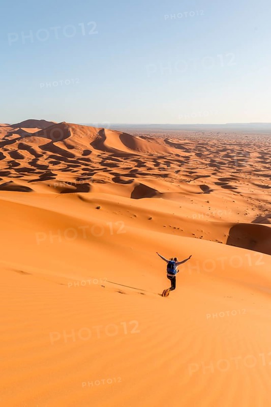 Woman running downhill
