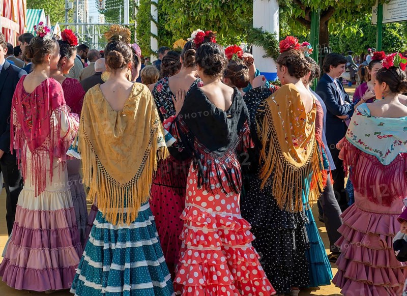 Spanish women with colorful flamenco dresses
