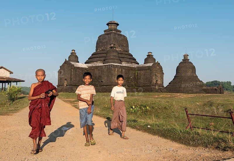 Boys play in front of Laymyetnha Paya