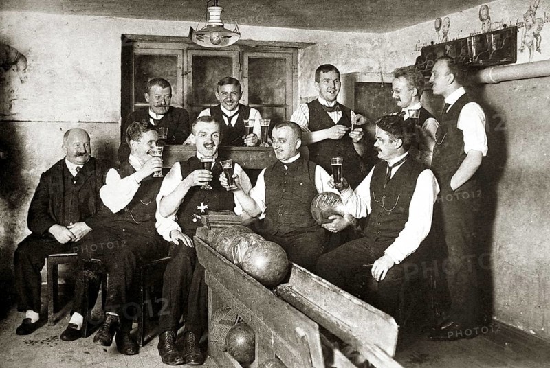Men in sociable bowling and drinking beer